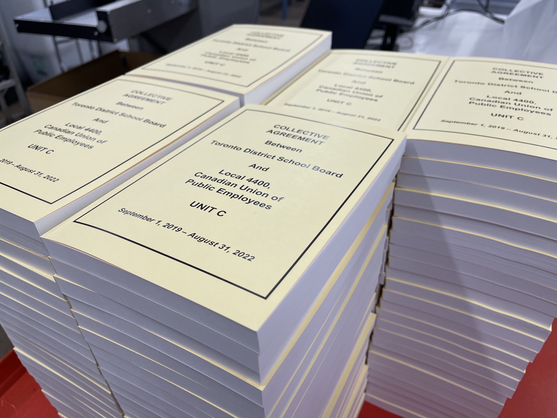 Stacks of collective agreements finished by Union Print