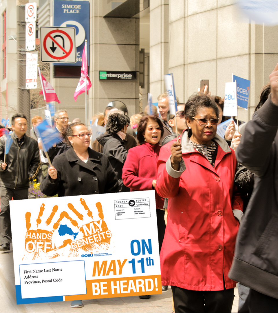 Union members carrying campaign signs in downtown Toronto