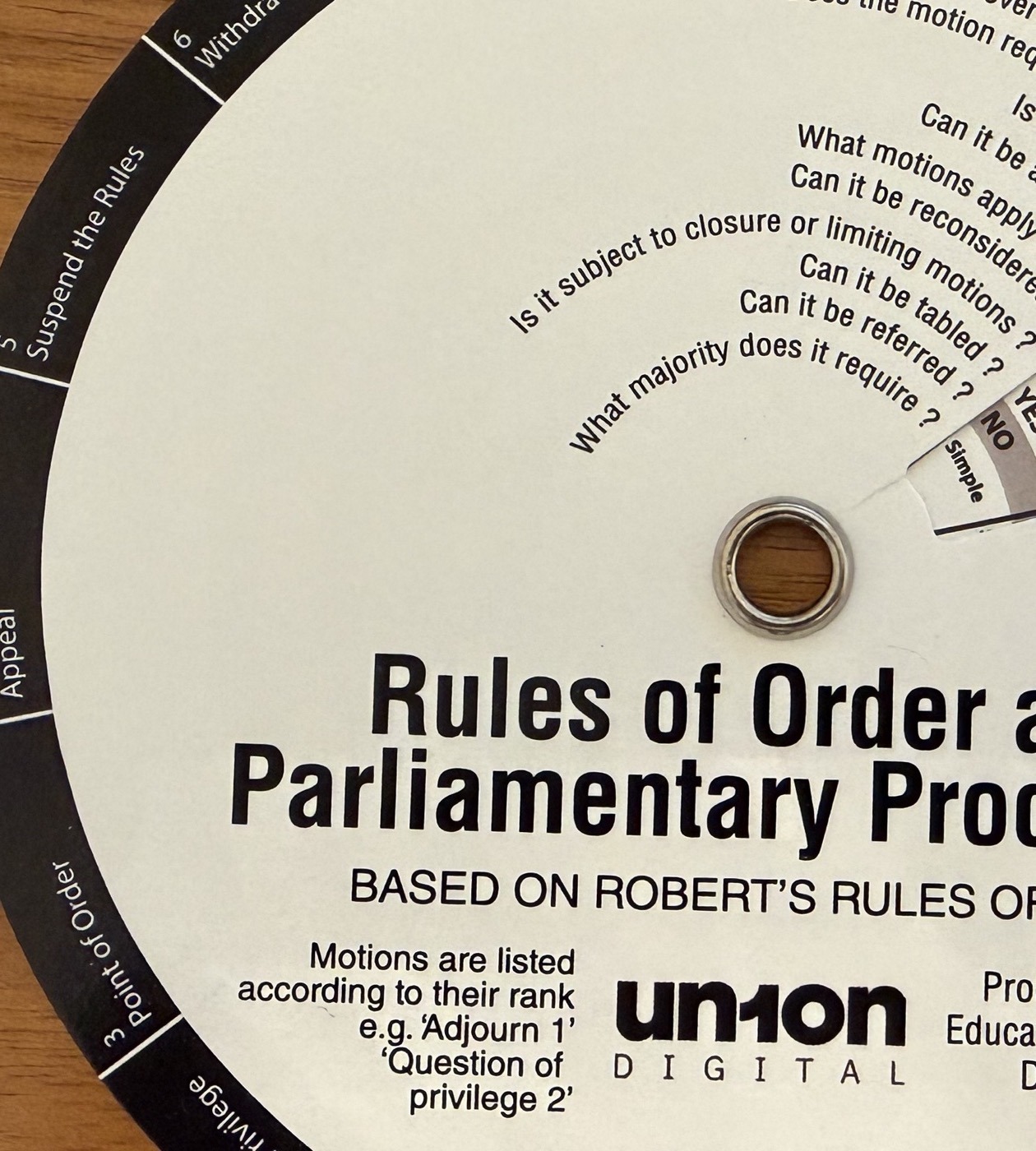 Close detail of the Roberts Rules of Order wheel